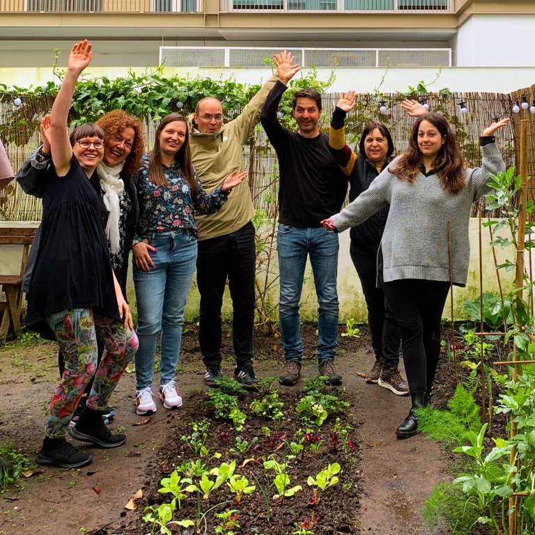 Teachers celebrating in the school garden